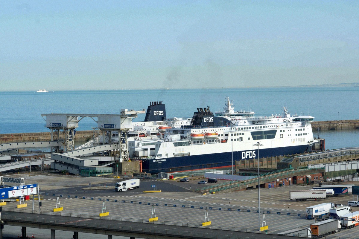Two DFDS ferries at the berths of Dover ferry port with vehicle lanes in the foreground